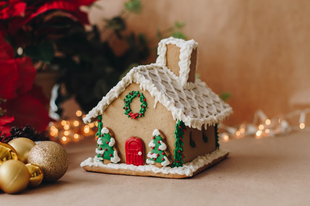 a gingerbread house decorated with christmas decorations