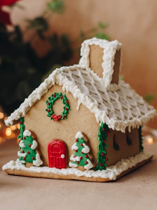 a gingerbread house decorated with christmas decorations