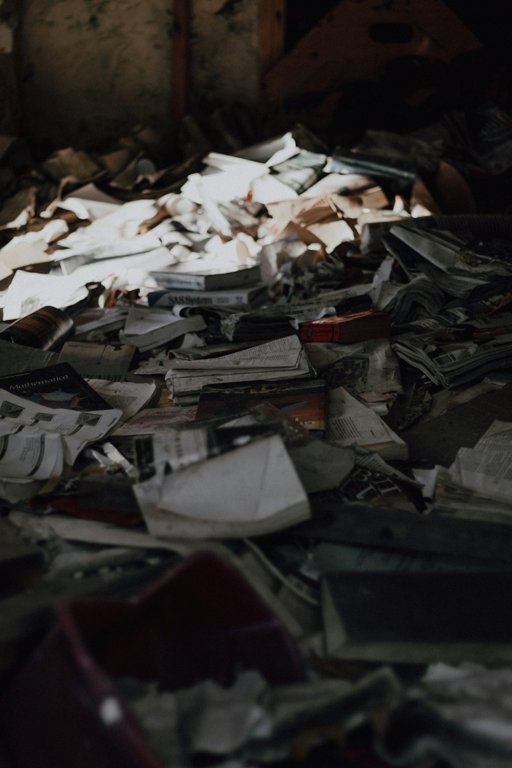 a pile of papers sitting on top of a floor