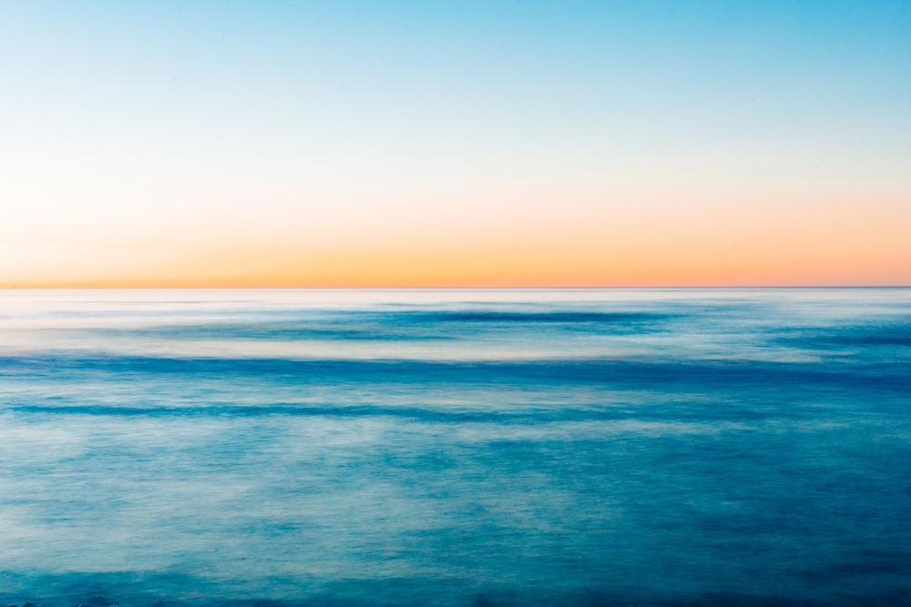 a view of a body of water at sunset