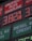 A large gas station price sign displays fuel prices with LED lights. The sign includes sections for unleaded gasoline, diesel, and other fuel types, with each section prominently showing prices in red and green LED numbers.