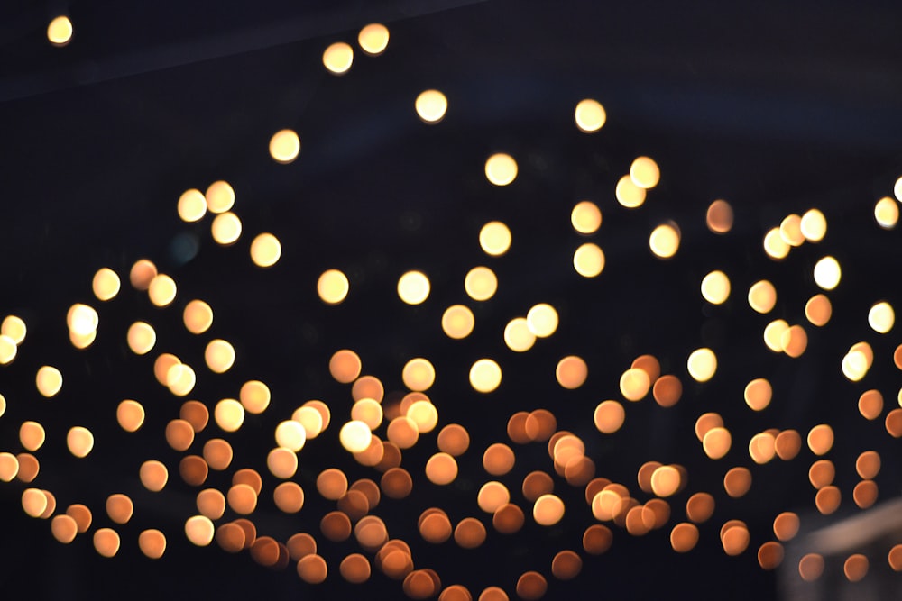 a bunch of lights that are hanging from a ceiling