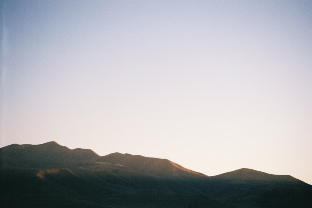 a view of a mountain range at sunset