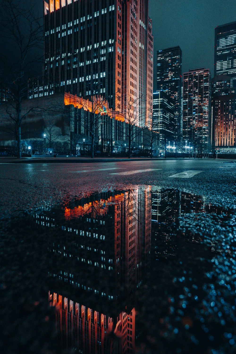 a very tall building sitting next to a body of water