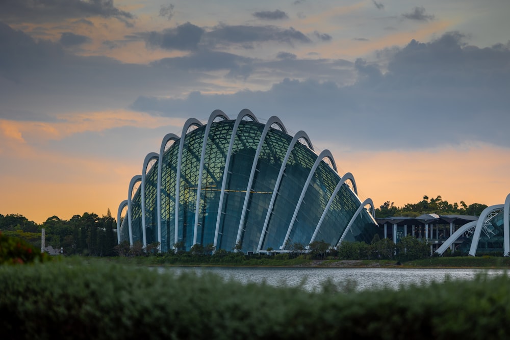 a large building sitting next to a body of water