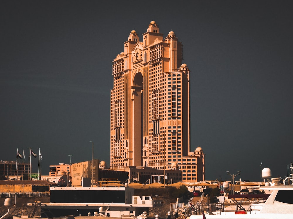 a very tall building with a lot of boats in front of it