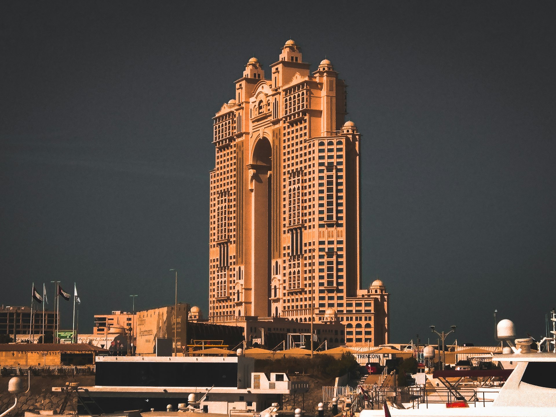 a very tall building with a lot of boats in front of it