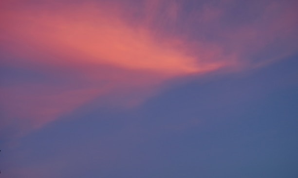 An anime-style sky with soft clouds and glowing blue hues symbolizing harmony.