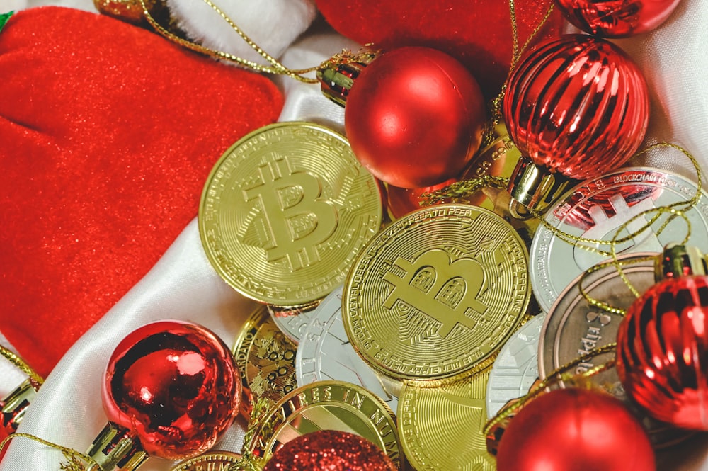 a pile of bitcoins and christmas ornaments