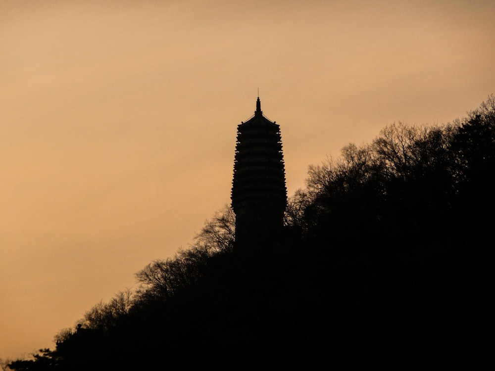 a tall tower with a clock on top of it