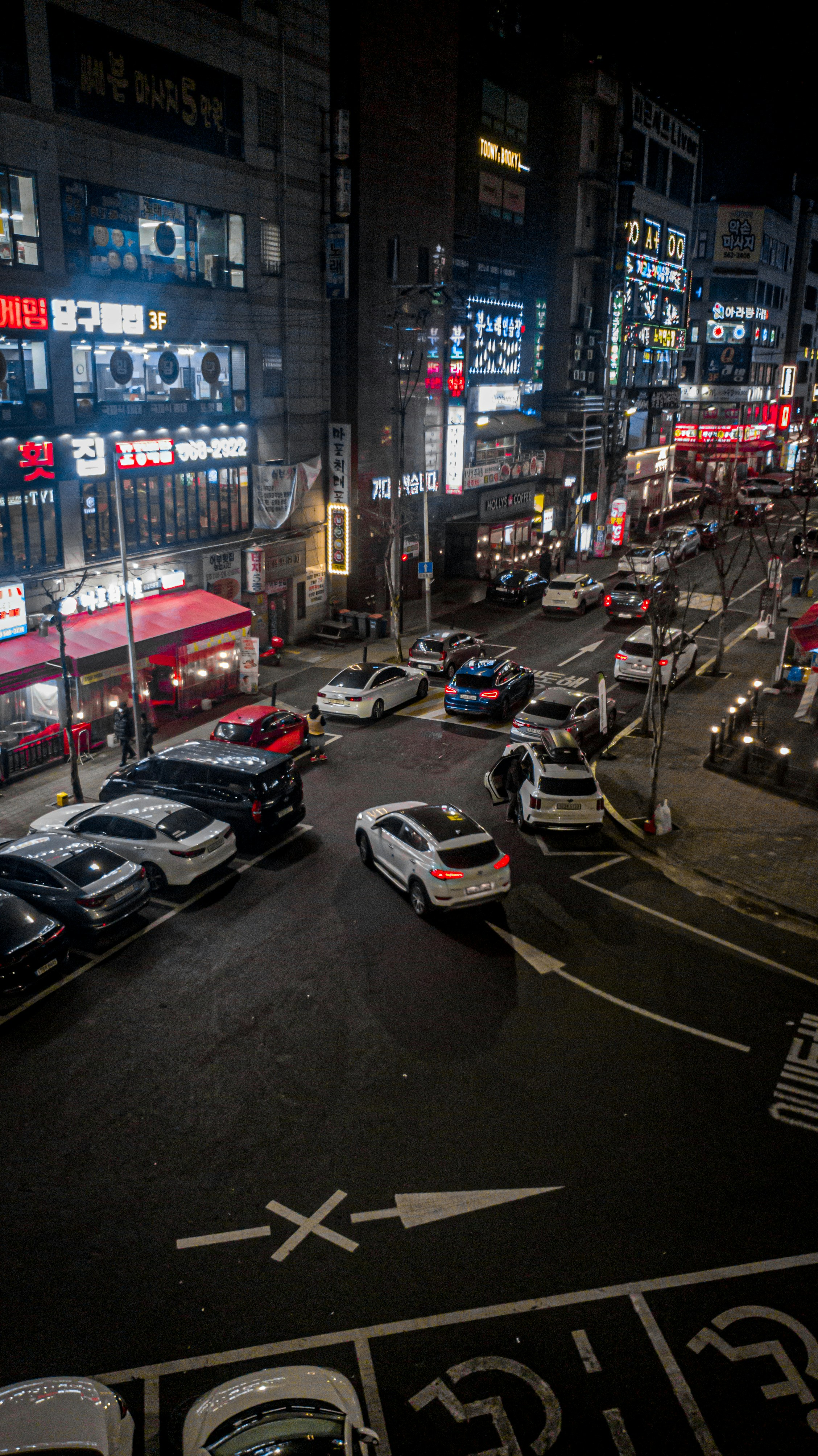 a city street at night with a lot of traffic