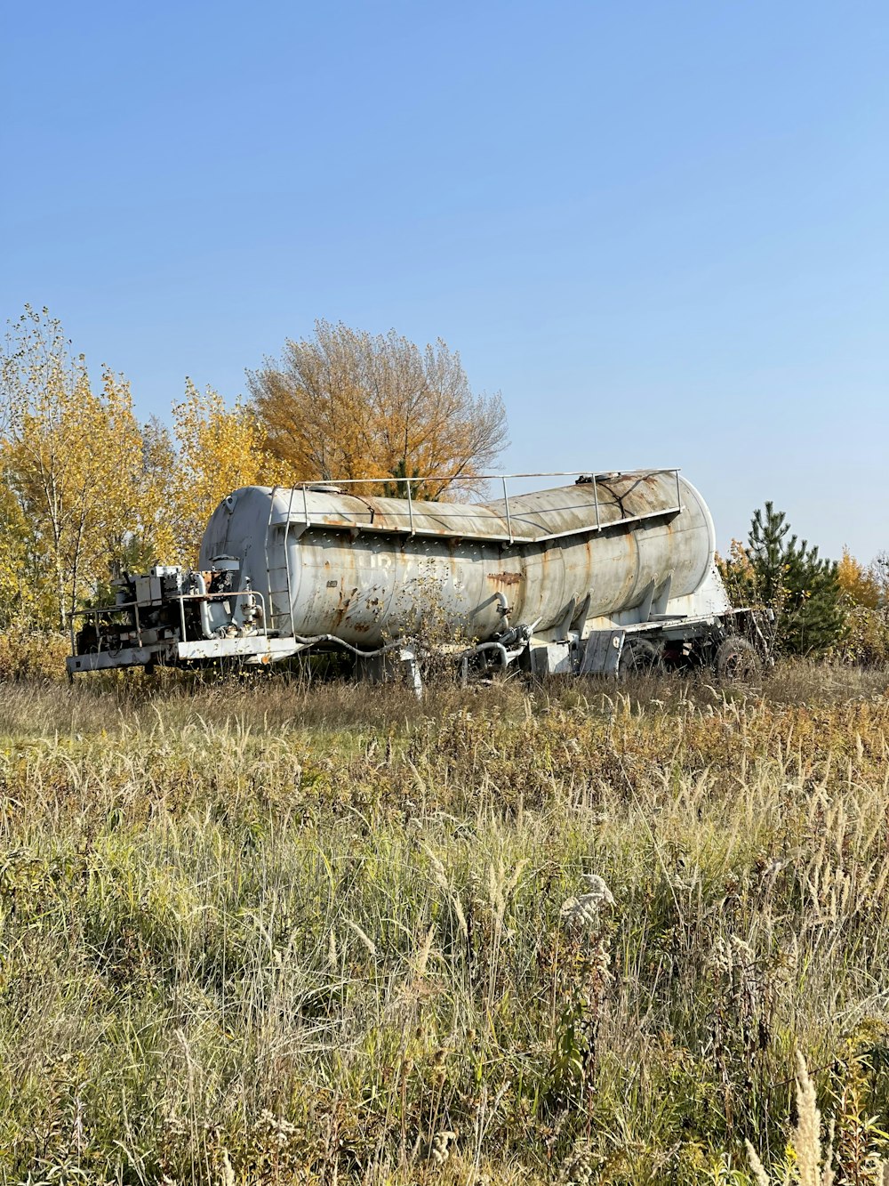 an old train car sitting in a field