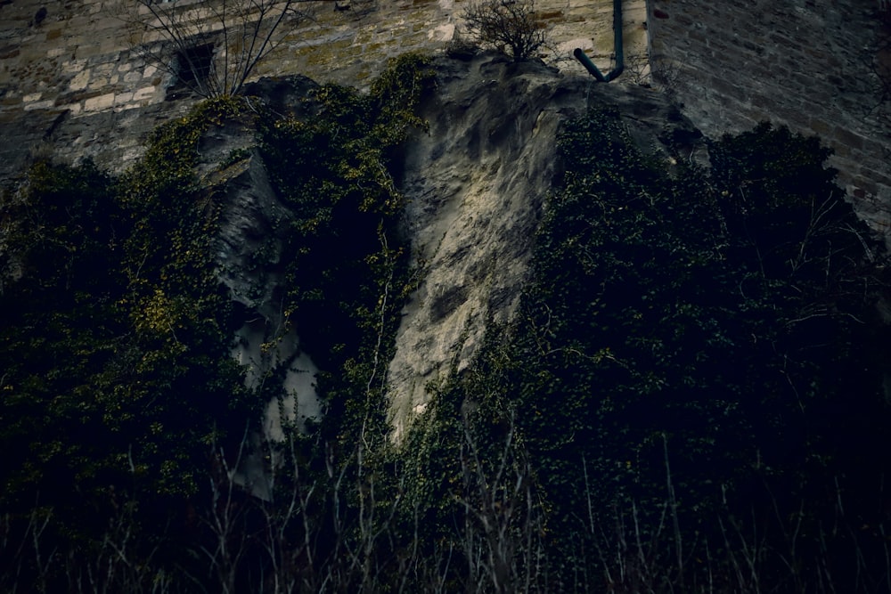 a clock on the side of a stone building