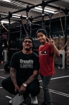 a man and a little girl posing for a picture
