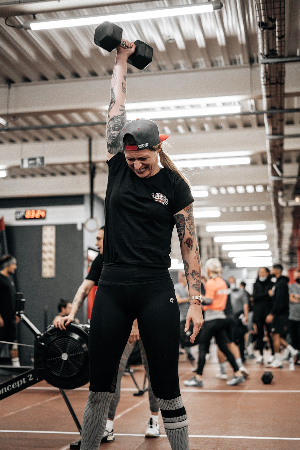 a man lifting a barbell in a gym