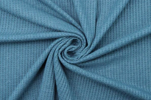 a close up shot of a blue fabric