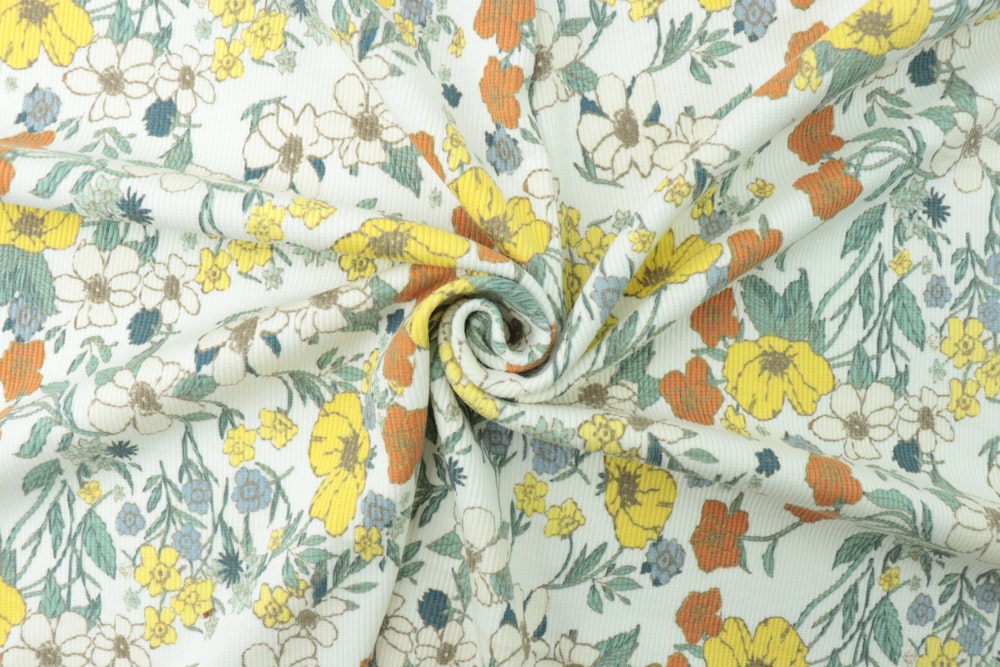 a close up of a fabric with flowers on it