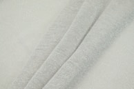 An elegant charcoal grey co-ord set laid flat on a textured linen surface, highlighting its premium fabric.