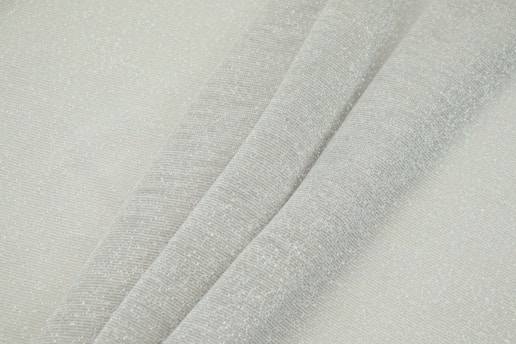 Close-up of softly folded premium grey linen fabric showcasing its natural texture and weave under gentle light.