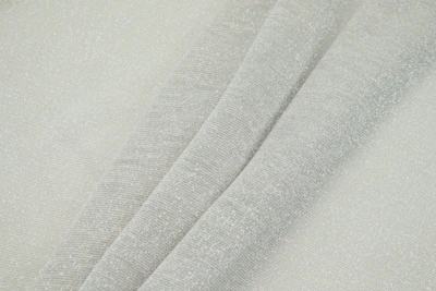 Close-up of light gray casual dress fabric with subtle texture, draped elegantly on a mannequin.