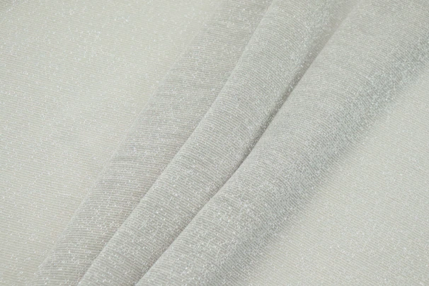 Close-up shot of a folded grey t-shirt showing the fabric texture and neat stitching details.