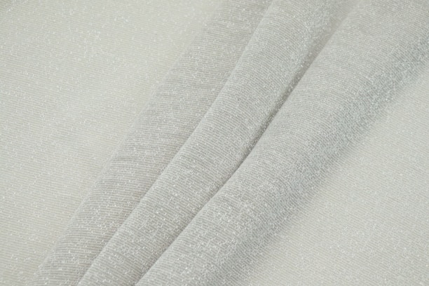 Close-up of slate grey scrub fabric showing its smooth texture and fine stitching.