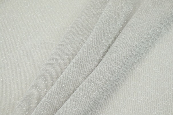 Close-up of a simple, elegant fabric texture in soft tones
