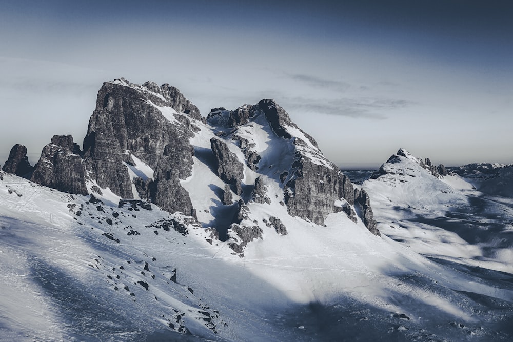 a snow covered mountain with a sky background