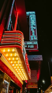 Late night scene outside Pizza Route 88 with glowing red and yellow neon signs.