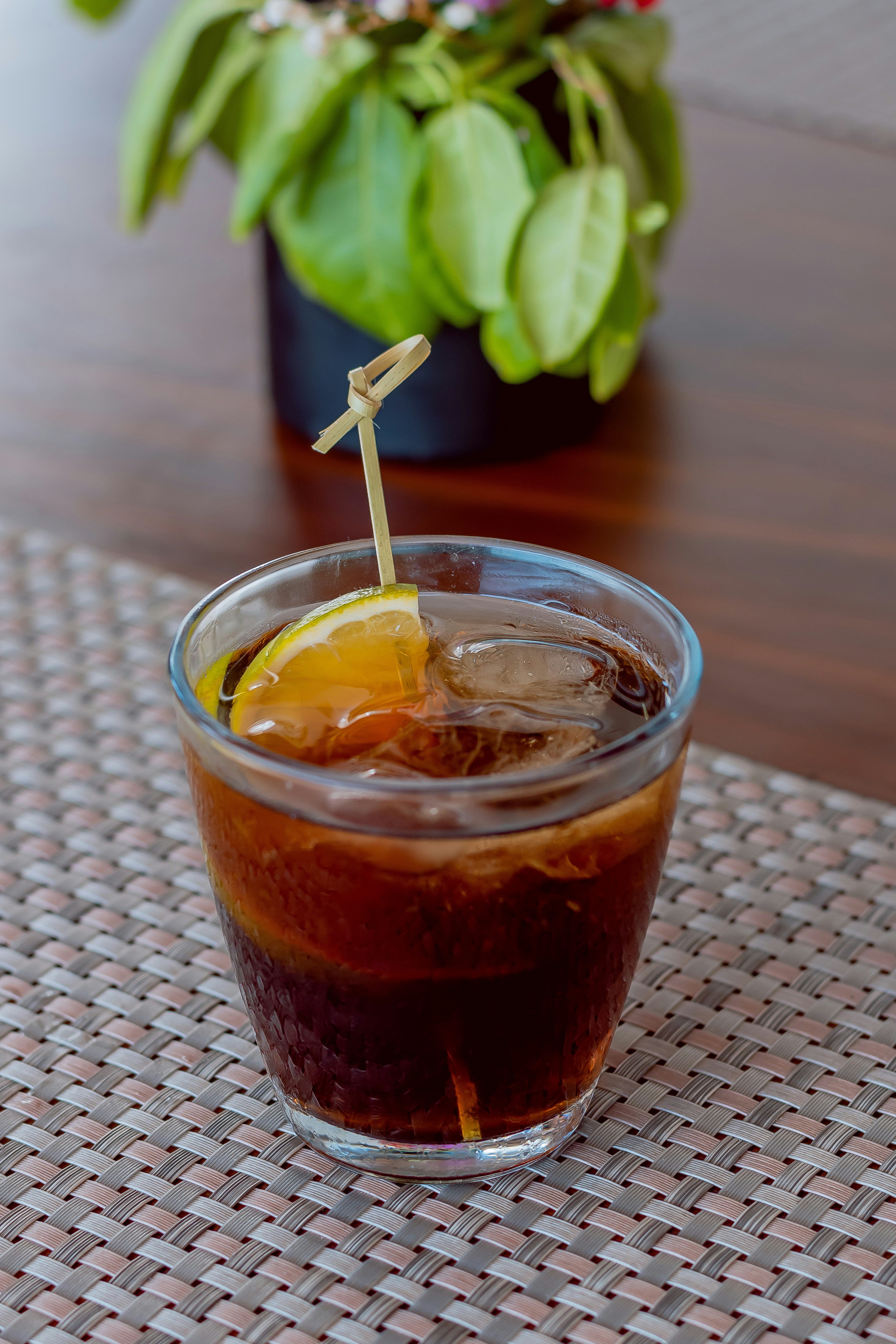 a glass of iced tea on a table