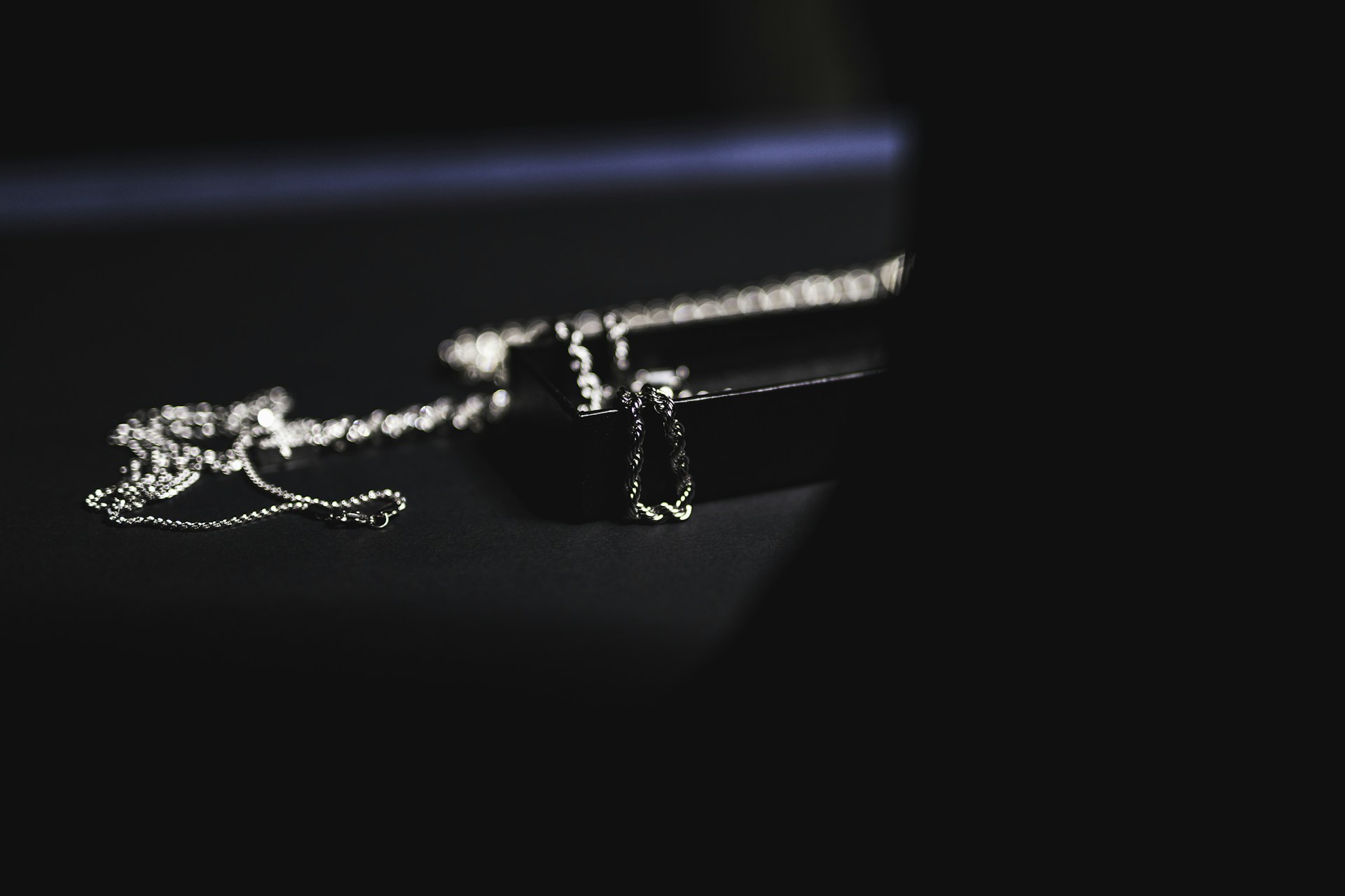 a pair of earrings sitting on top of a table