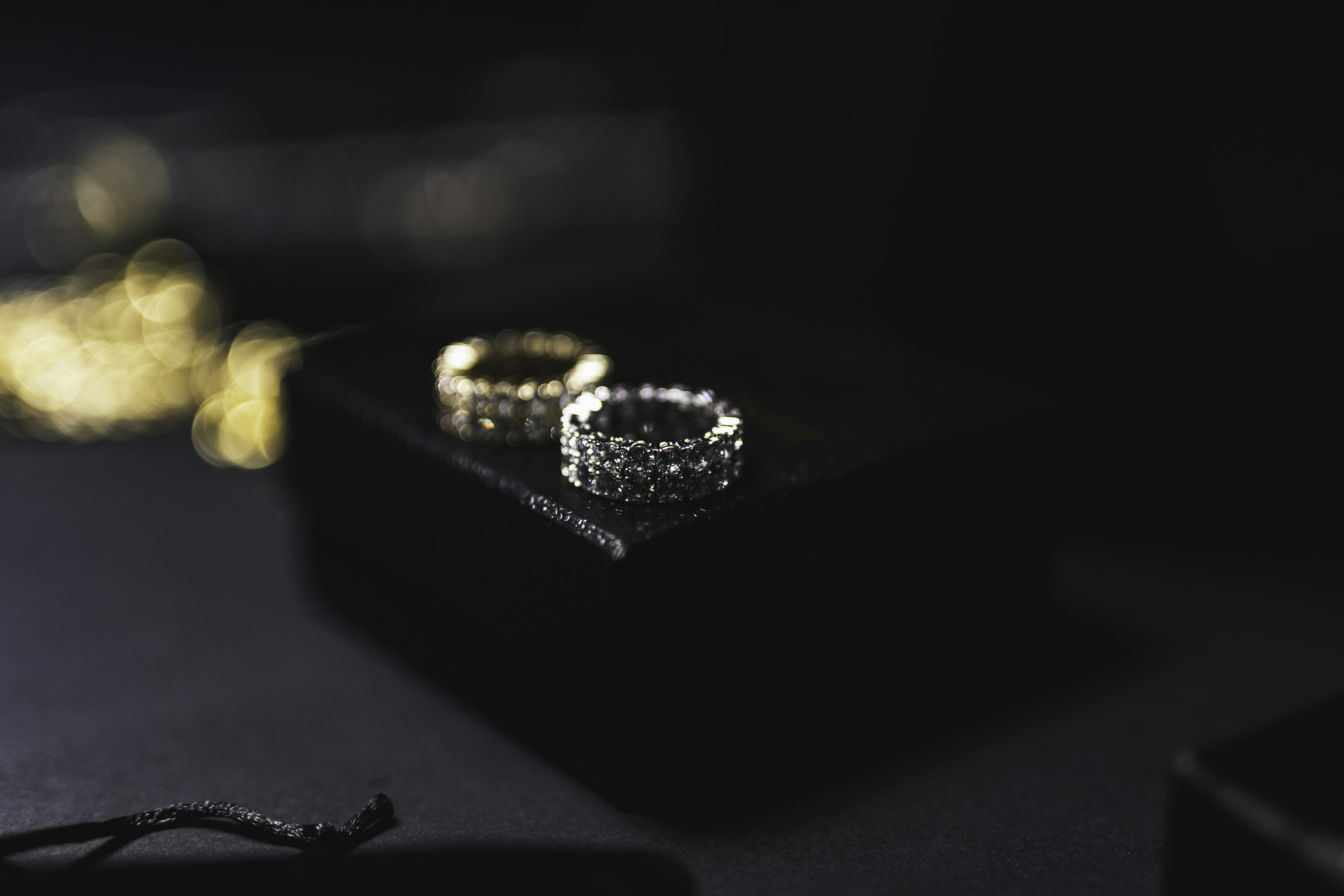 a couple of wedding rings sitting on top of a table