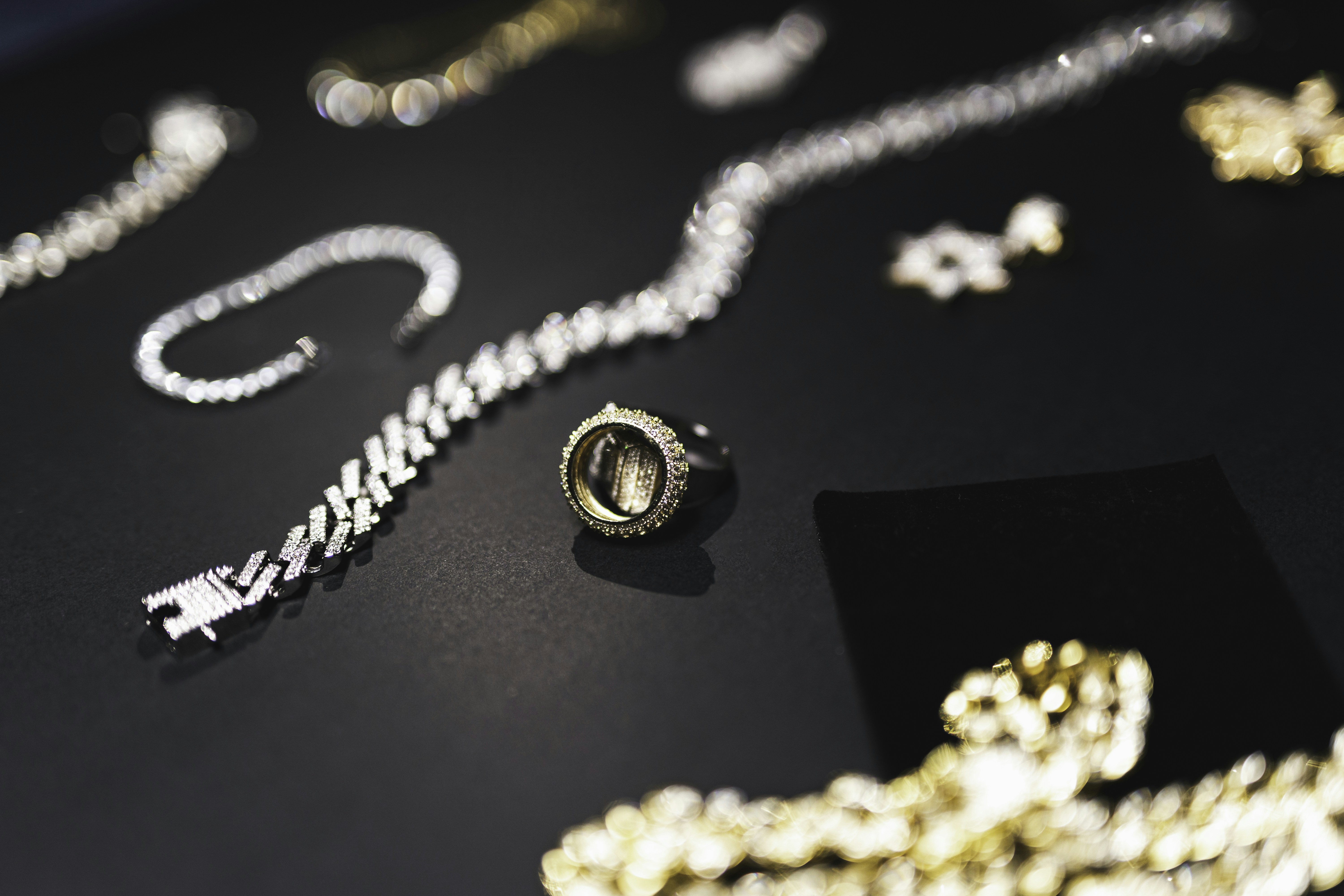 a table topped with lots of different types of jewelry