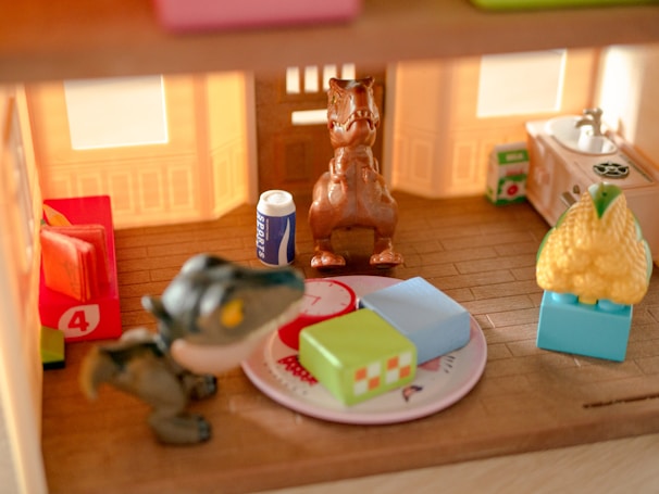 A child happily playing with a robotic dinosaur toy in a bright living room.