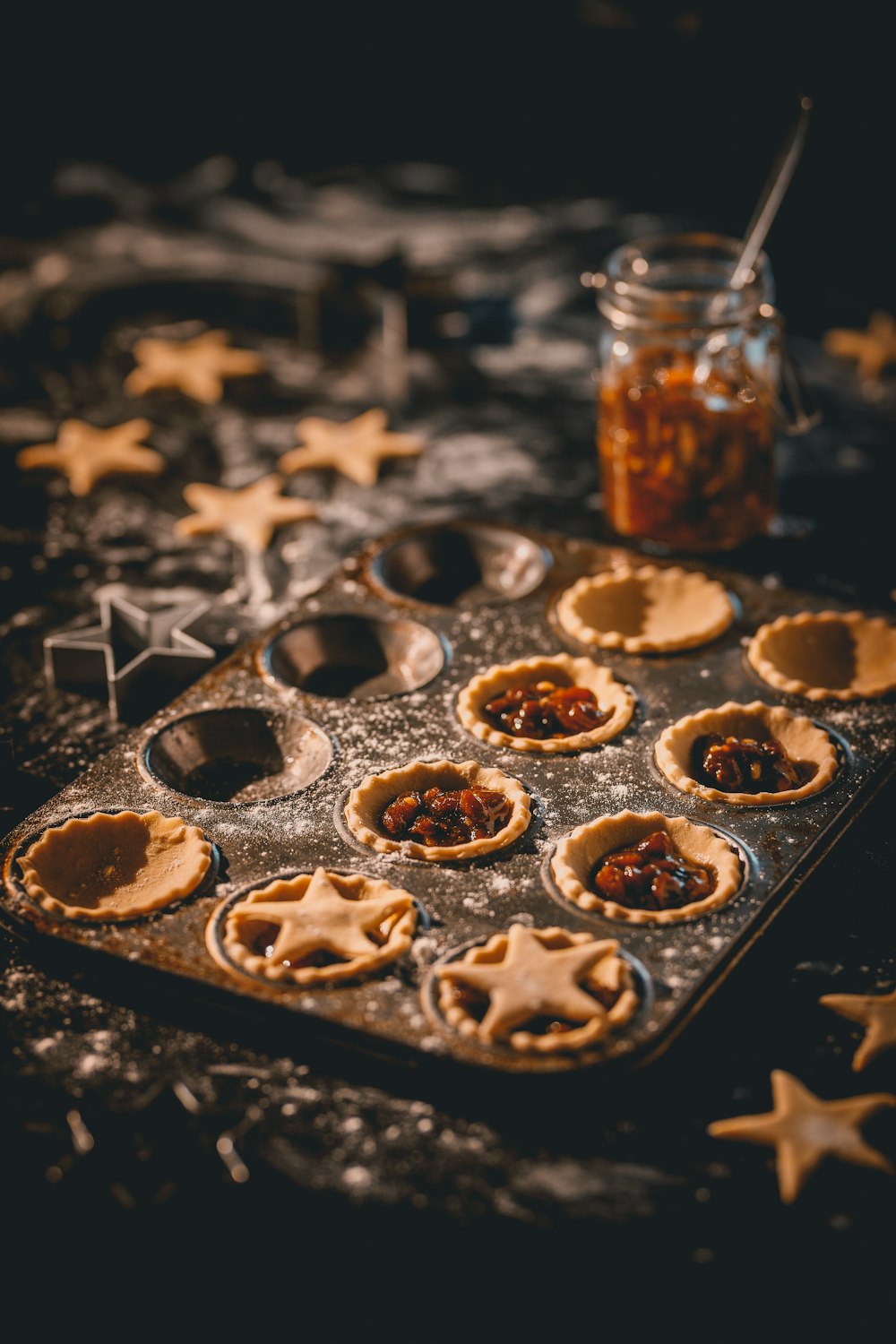 a baking tray filled with mini pies on top of a table