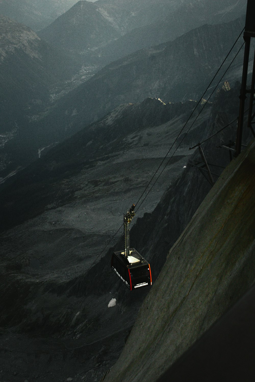 a cable car going up a mountain side