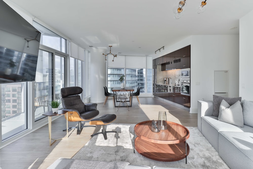 a living room filled with furniture and a flat screen tv