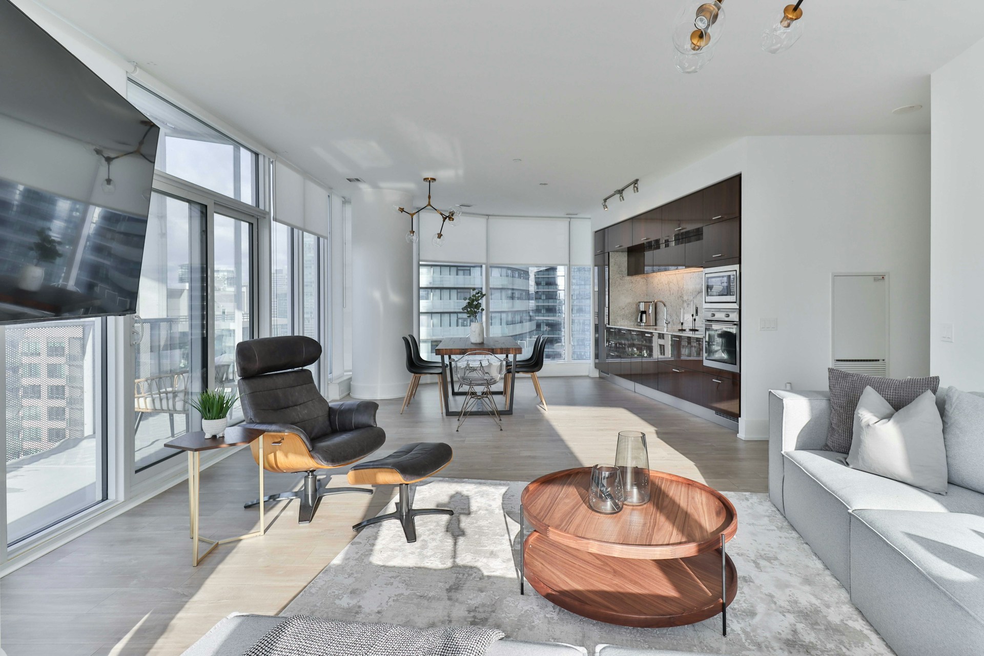 a living room filled with furniture and a flat screen tv