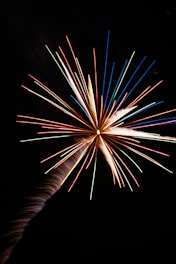 An artistic visualization of the Big Bang expanding the universe from a singular point.