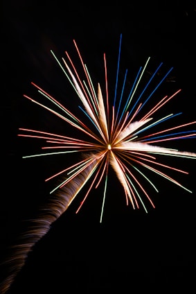 An artistic visualization of the Big Bang expanding the universe from a singular point.