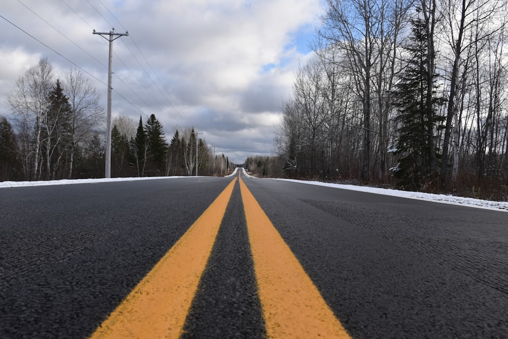 a road with two yellow lines on the side of it