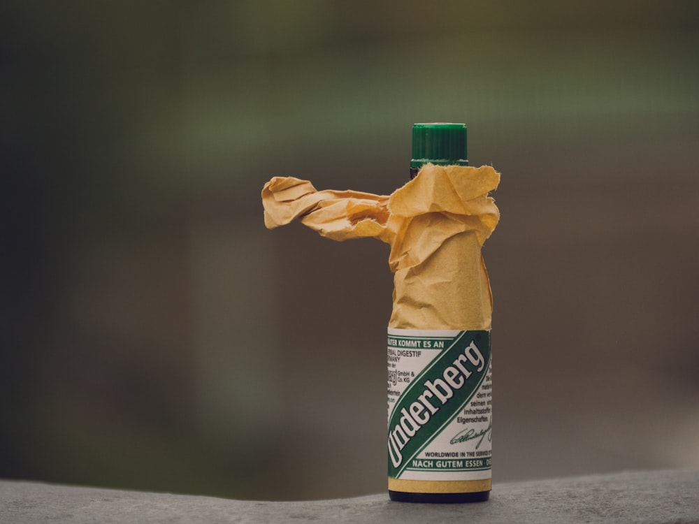 a bottle of mustard sitting on top of a table