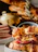 Close-up of a gourmet deli sandwich with fresh ingredients on artisan bread.