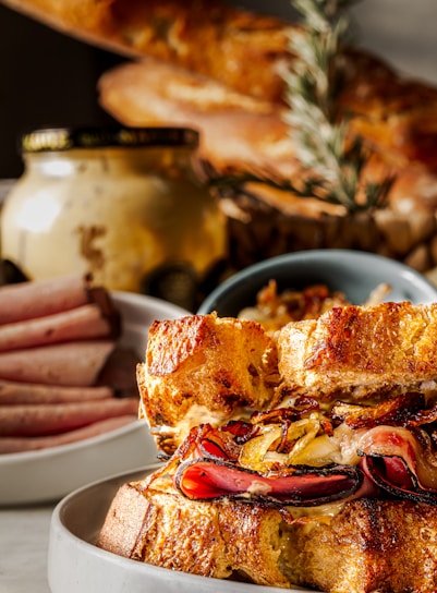 Close-up of a freshly prepared gourmet sandwich with vibrant, crisp vegetables and artisan bread.