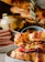 Close-up of a gourmet deli sandwich with fresh ingredients on artisan bread.