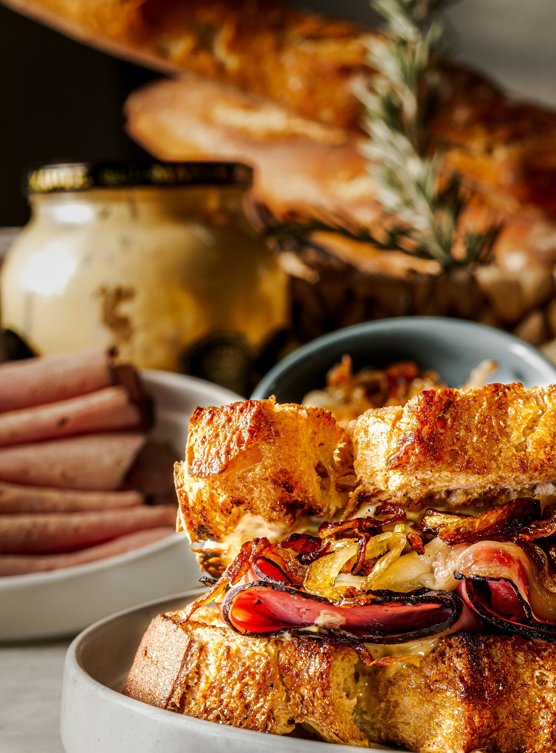 Close-up of a sizzling Italian-style panini being prepared, highlighting the snack's fresh ingredients.