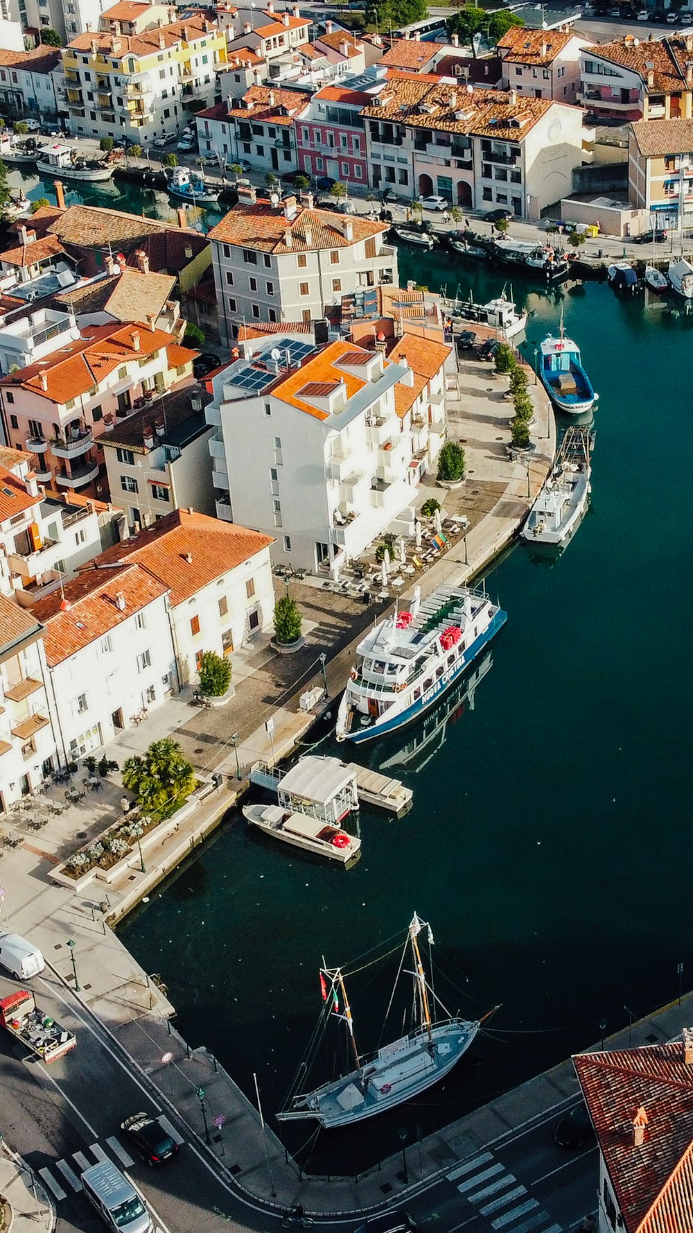 a harbor with boats and buildings in the background