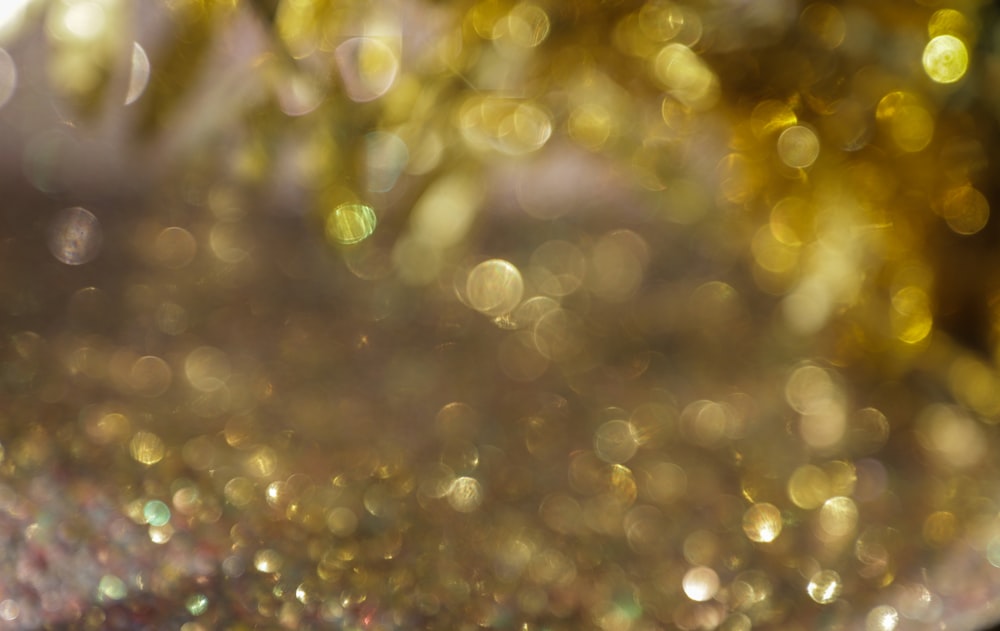 a close up of a gold glitter background