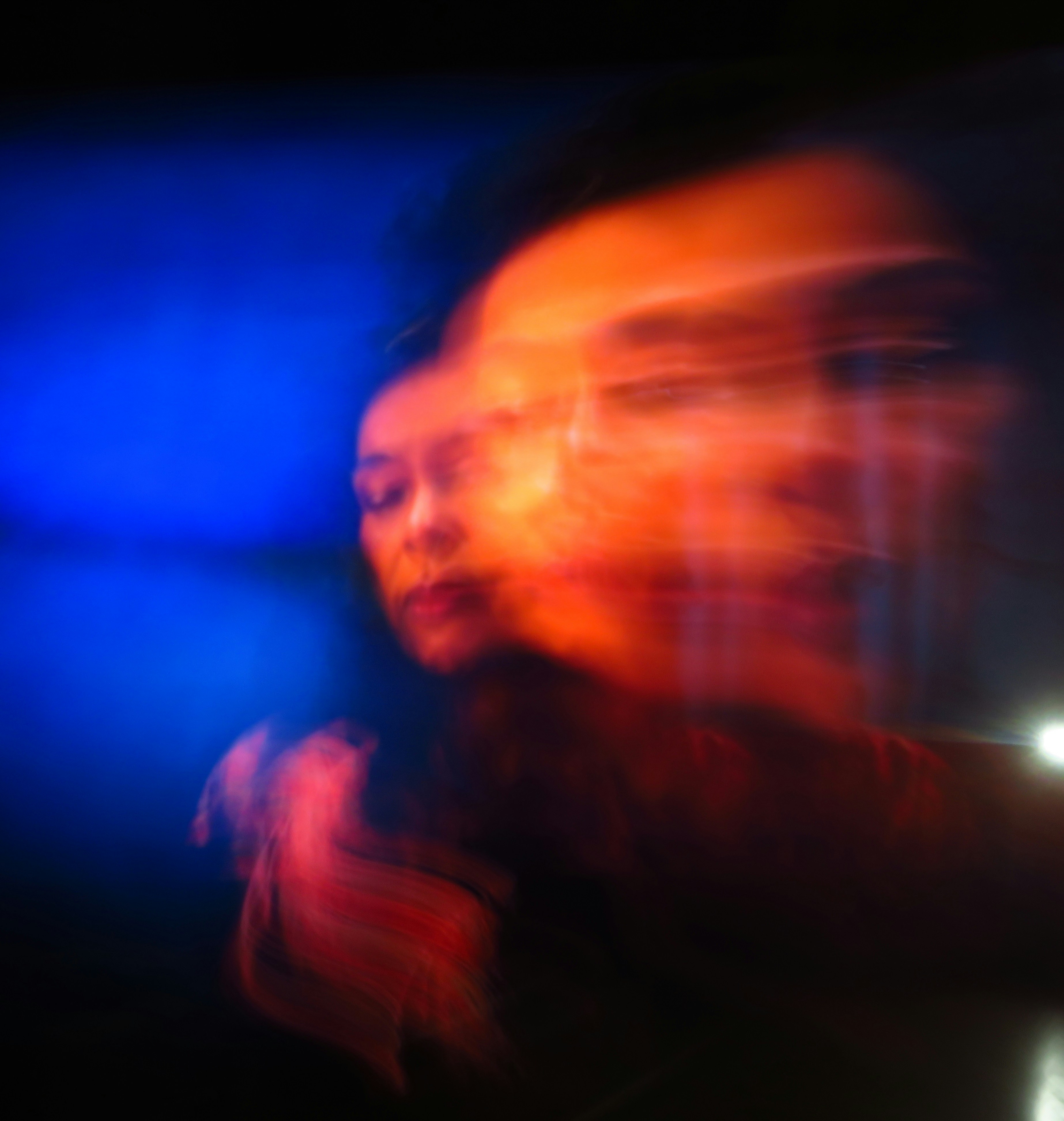 a blurry photo of a person with a cell phone