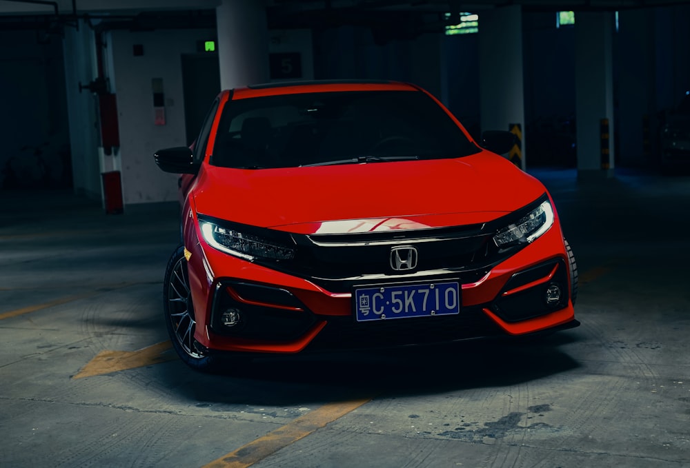 a red car parked in a parking garage